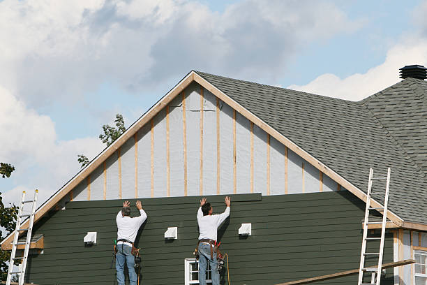 Professional Siding technician working in White Hall, MD
